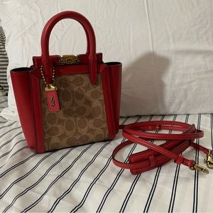 SOLD Coach red troupe 17